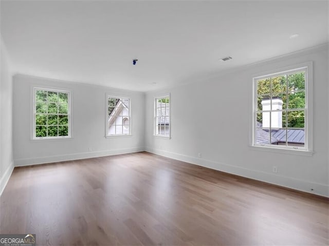 3625 Tuxedo Rd NW, Atlanta, GA 30305 - unfurnished room with healthy amount of natural light, wood finished floors, and baseboards