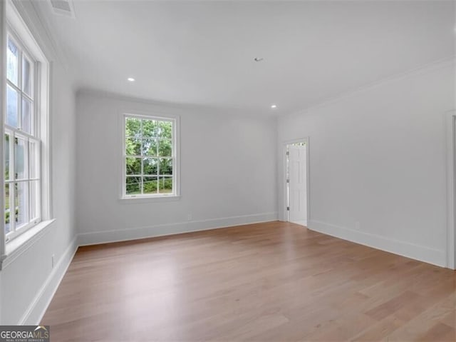 3625 Tuxedo Rd NW, Atlanta, GA 30305 - empty room featuring light wood-style flooring, baseboards, crown molding, and recessed lighting