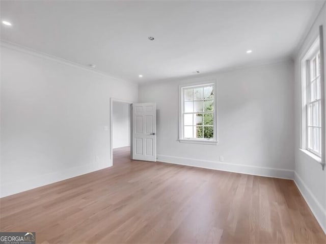 3625 Tuxedo Rd NW, Atlanta, GA 30305 - empty room with healthy amount of natural light, light wood finished floors, baseboards, recessed lighting, and ornamental molding