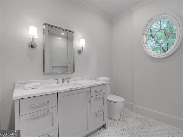 3625 Tuxedo Rd NW, Atlanta, GA 30305 - bathroom featuring toilet, vanity, tile patterned floors, and baseboards