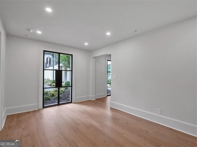 3625 Tuxedo Rd NW, Atlanta, GA 30305 - spare room with baseboards, wood finished floors, and recessed lighting