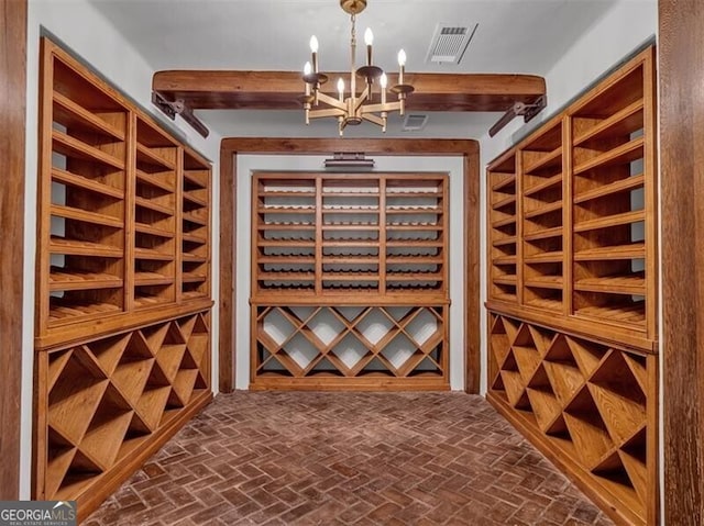 3625 Tuxedo Rd NW, Atlanta, GA 30305 - wine cellar with brick flooring, a chandelier, and beamed ceiling