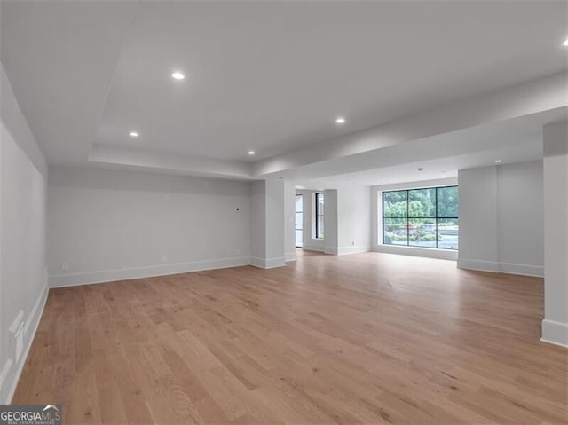 3625 Tuxedo Rd NW, Atlanta, GA 30305 - empty room featuring light wood-type flooring, baseboards, recessed lighting, and a raised ceiling