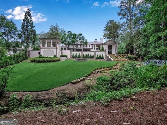 3625 Tuxedo Rd NW, Atlanta, GA 30305 - rear view of house featuring a lawn