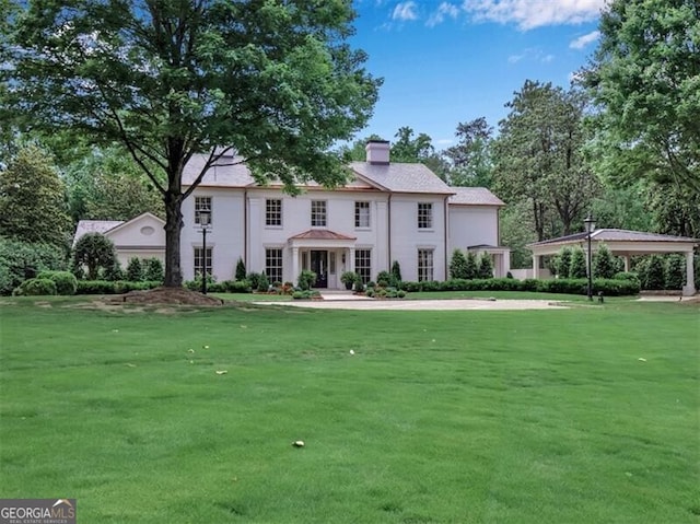 3625 Tuxedo Rd NW, Atlanta, GA 30305 - colonial house with a front lawn and a chimney