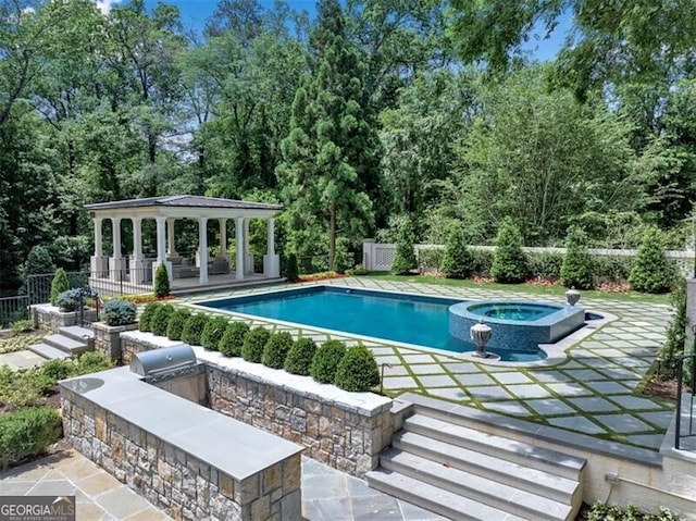 3625 Tuxedo Rd NW, Atlanta, GA 30305 - view of swimming pool featuring a gazebo, a pool with connected hot tub, a patio, and view of scattered trees