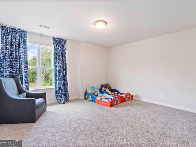rec room featuring carpet and baseboards