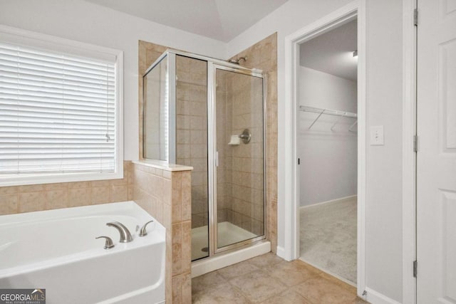 456 Crestmont Ln, Canton, GA 30114 - bathroom with a stall shower, a garden tub, a spacious closet, and tile patterned flooring