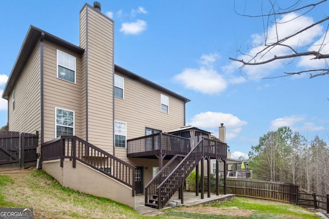 456 Crestmont Ln, Canton, GA 30114 - back of house with stairs, a chimney, a wooden deck, and a patio