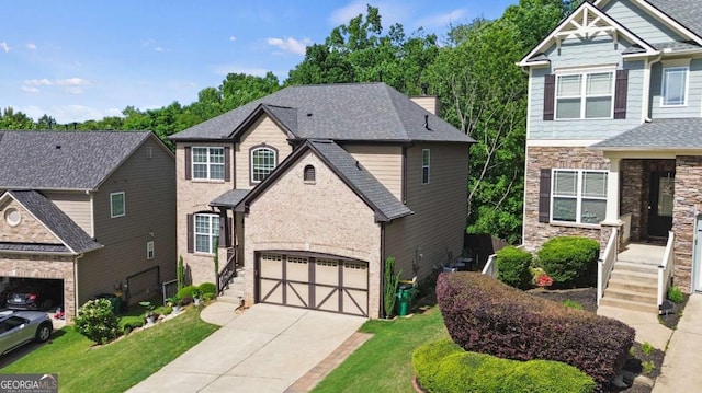 456 Crestmont Ln, Canton, GA 30114 - view of front facade featuring driveway, a front lawn, an attached garage, stone siding, and brick siding