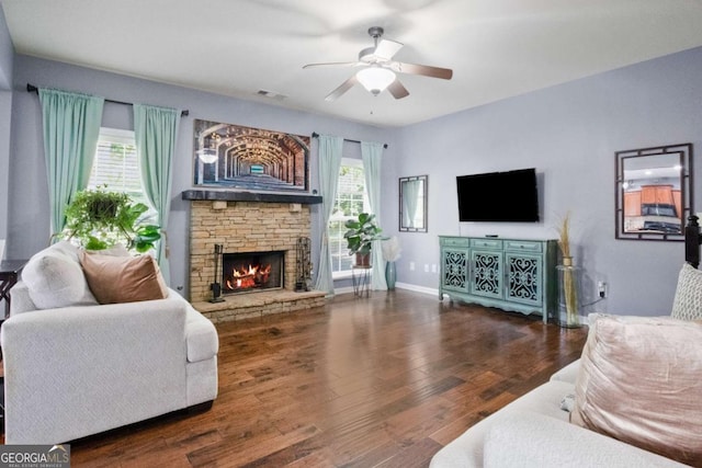 456 Crestmont Ln, Canton, GA 30114 - living room featuring ceiling fan, a stone fireplace, and wood finished floors
