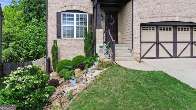 456 Crestmont Ln, Canton, GA 30114 - doorway to property featuring brick siding, concrete driveway, and an attached garage