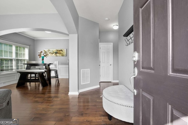 456 Crestmont Ln, Canton, GA 30114 - entryway with arched walkways, dark wood-type flooring, a wainscoted wall, crown molding, and a decorative wall