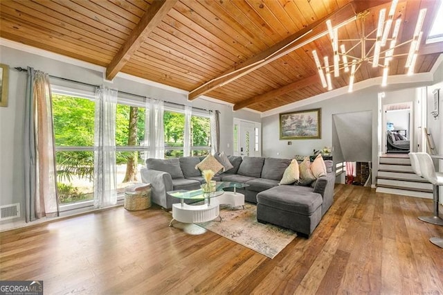 4882 Rock Haven Dr SW, Lilburn, GA 30047 - living room with wood finished floors, plenty of natural light, wooden ceiling, and a chandelier