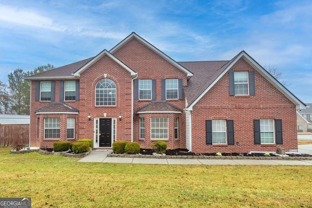 1439 Alice Ave, Lithonia, GA 30058 - colonial-style house with brick siding and a front yard