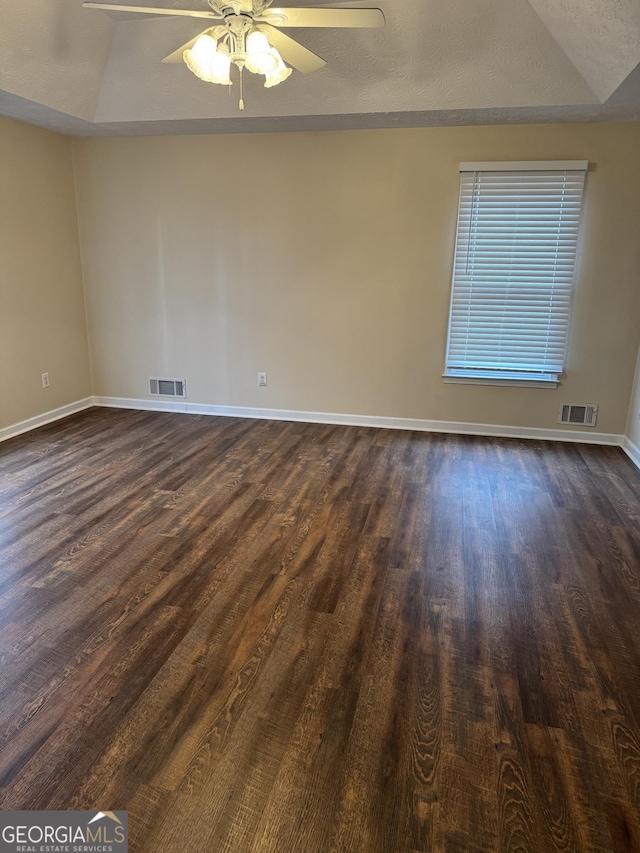 143 Tracy Ln, Mcdonough, GA 30253 - unfurnished room with dark wood finished floors, baseboards, and a ceiling fan