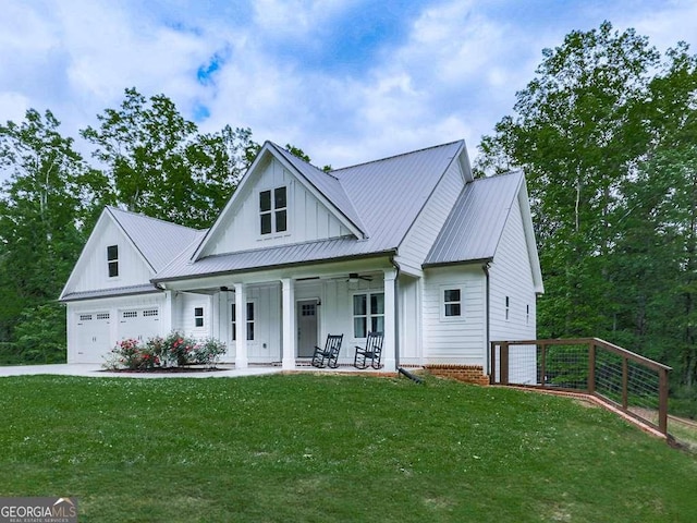 2700 Sam Nelson Rd, Canton, GA 30114 - modern inspired farmhouse featuring board and batten siding, covered porch, ceiling fan, and a front yard