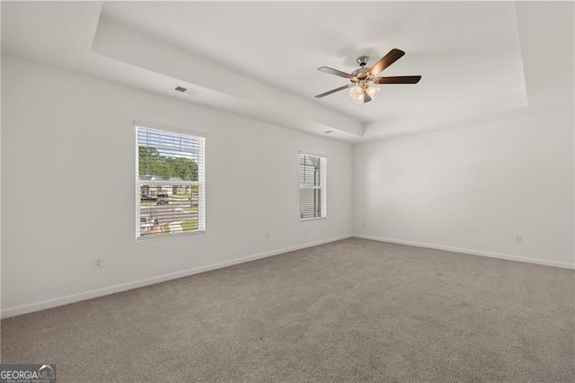 45 Vermillion Way, Covington, GA 30016 - spare room featuring a raised ceiling, ceiling fan, and carpet floors