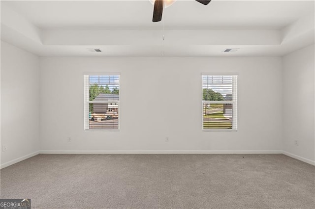 45 Vermillion Way, Covington, GA 30016 - carpeted spare room featuring healthy amount of natural light, ceiling fan, and a tray ceiling