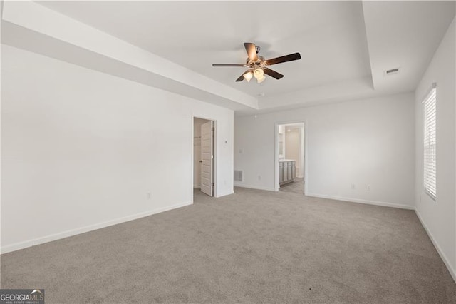 45 Vermillion Way, Covington, GA 30016 - unfurnished bedroom featuring a tray ceiling, carpet, and ensuite bath