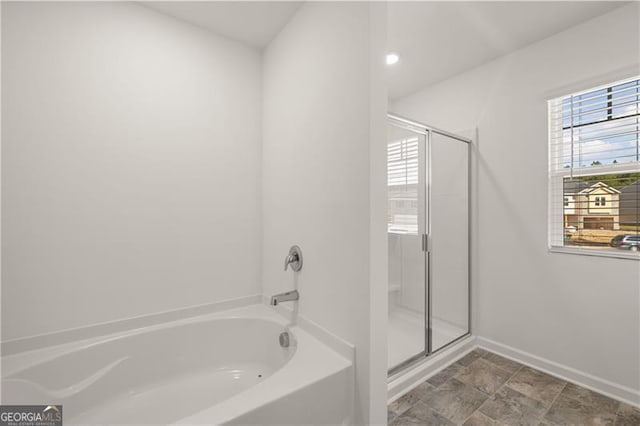 45 Vermillion Way, Covington, GA 30016 - full bathroom featuring a bath and a stall shower