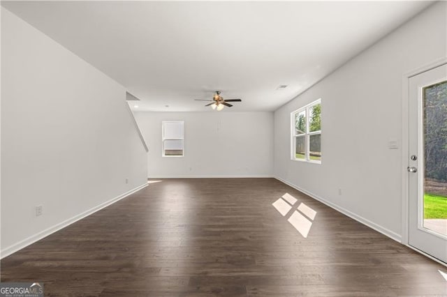 45 Vermillion Way, Covington, GA 30016 - unfurnished living room with dark wood-style flooring and a ceiling fan