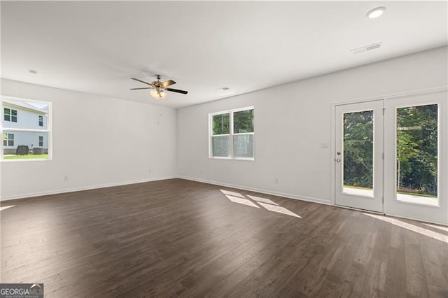 45 Vermillion Way, Covington, GA 30016 - spare room featuring healthy amount of natural light, dark wood-style flooring, and a ceiling fan