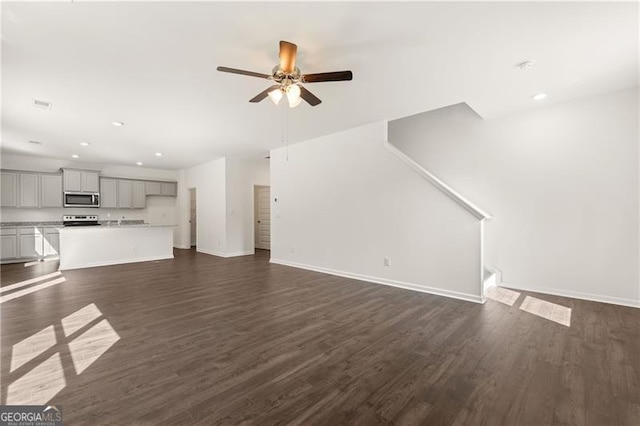 45 Vermillion Way, Covington, GA 30016 - unfurnished living room with ceiling fan, recessed lighting, and dark wood-type flooring
