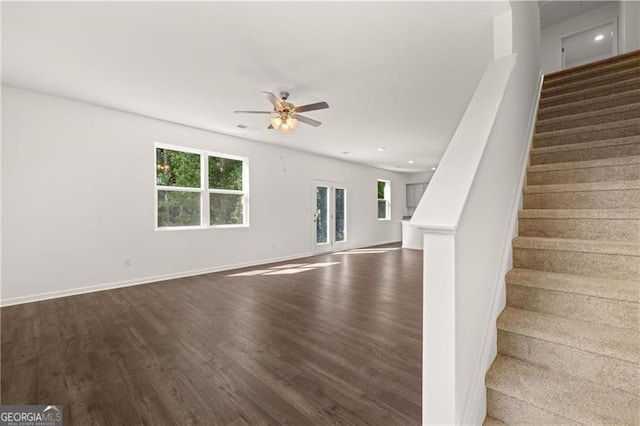 45 Vermillion Way, Covington, GA 30016 - unfurnished living room featuring stairway, dark wood finished floors, a ceiling fan, and recessed lighting