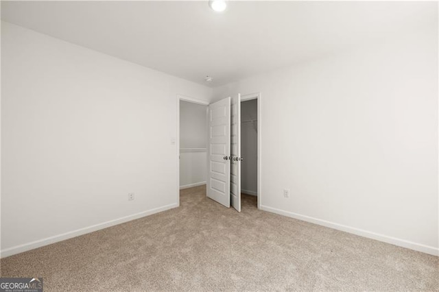 45 Vermillion Way, Covington, GA 30016 - unfurnished bedroom with light carpet, a spacious closet, a closet, and recessed lighting