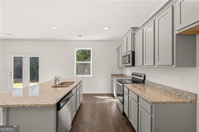 45 Vermillion Way, Covington, GA 30016 - kitchen with stainless steel appliances, gray cabinets, a center island with sink, dark wood-style flooring, and recessed lighting