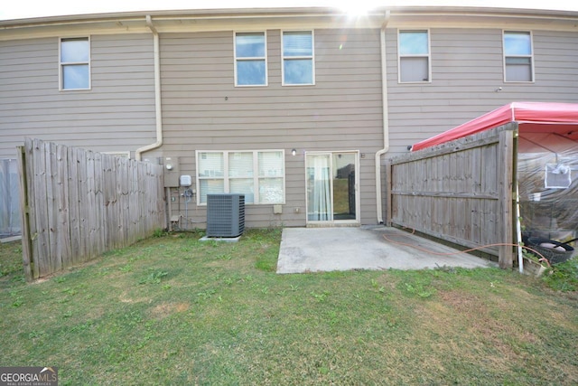 1560 Iris Walk, Jonesboro, GA 30238 - back of house featuring central AC and a patio area