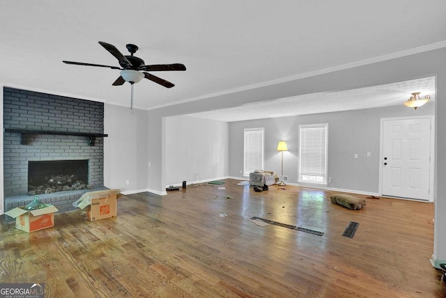 1315 Arden Dr SW, Marietta, GA 30008 - unfurnished living room featuring wood finished floors, ceiling fan, baseboards, crown molding, and a fireplace