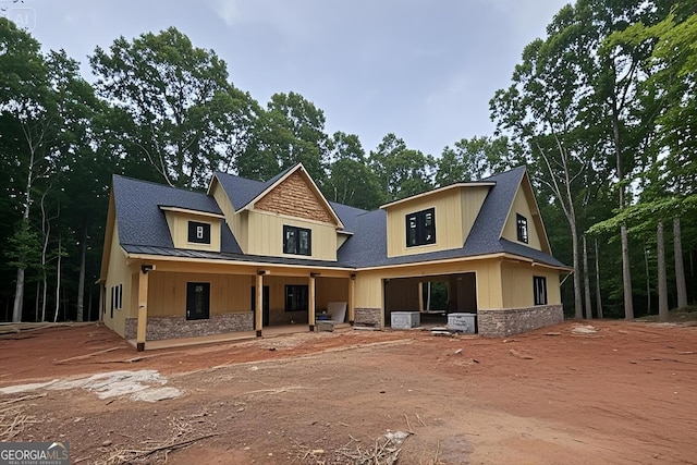 465 Stone Creek Dr, Hull, GA 30646 - view of front facade featuring stone siding, a porch, and a standing seam roof