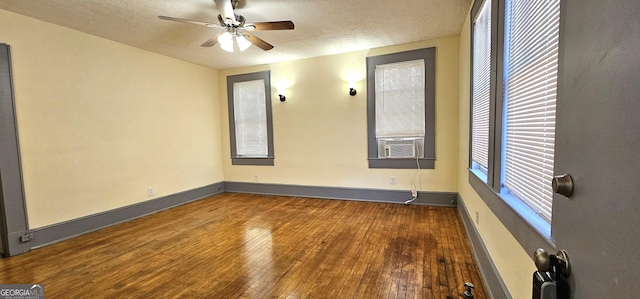 800 Verner St NW, Atlanta, GA 30318 - empty room with a ceiling fan, wood-type flooring, a textured ceiling, baseboards, and cooling unit