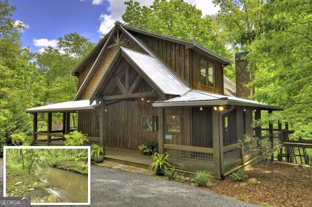 179 Huckleberry Ln, Ellijay, GA 30536 - exterior space with metal roof and a sunroom