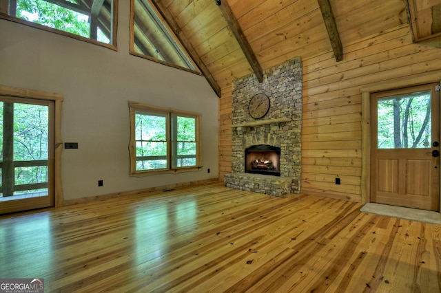 179 Huckleberry Ln, Ellijay, GA 30536 - unfurnished living room with high vaulted ceiling, hardwood / wood-style flooring, beam ceiling, wood ceiling, and a fireplace