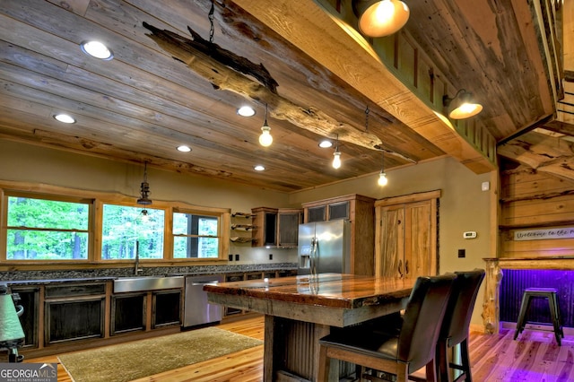 179 Huckleberry Ln, Ellijay, GA 30536 - kitchen with stainless steel appliances, a sink, dark countertops, wood ceiling, and light wood-type flooring