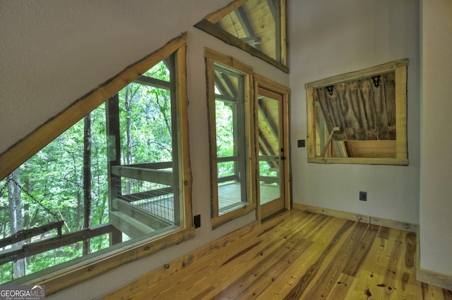 179 Huckleberry Ln, Ellijay, GA 30536 - doorway to outside featuring wood finished floors, baseboards, and vaulted ceiling