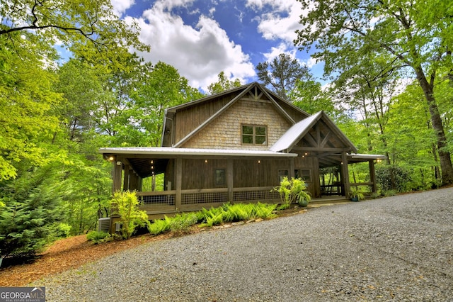 179 Huckleberry Ln, Ellijay, GA 30536 - view of front of property with metal roof, a porch, and driveway