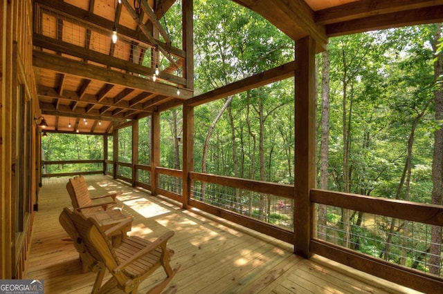 179 Huckleberry Ln, Ellijay, GA 30536 - unfurnished sunroom with a wooded view