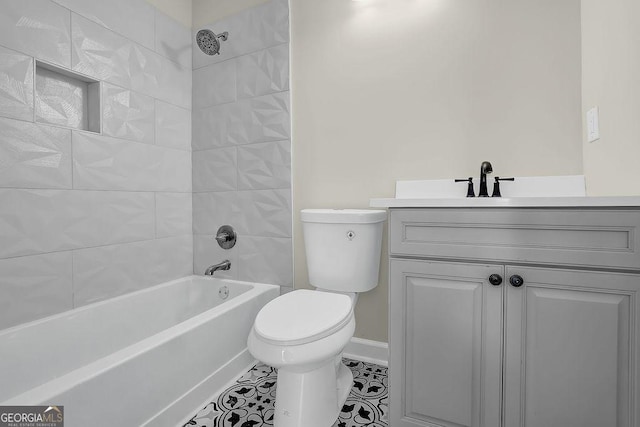 3571 Kennesaw Station Dr NW, Kennesaw, GA 30144 - bathroom with toilet, baseboards, washtub / shower combination, vanity, and tile patterned floors