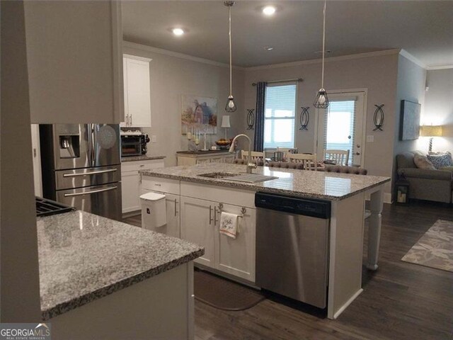 116 Four Seasons Blvd, Dallas, GA 30132 - kitchen featuring stainless steel appliances, a sink, crown molding, dark wood-type flooring, and a center island with sink