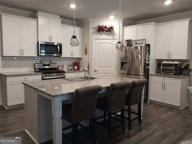 116 Four Seasons Blvd, Dallas, GA 30132 - kitchen featuring stainless steel appliances, crown molding, white cabinetry, and recessed lighting