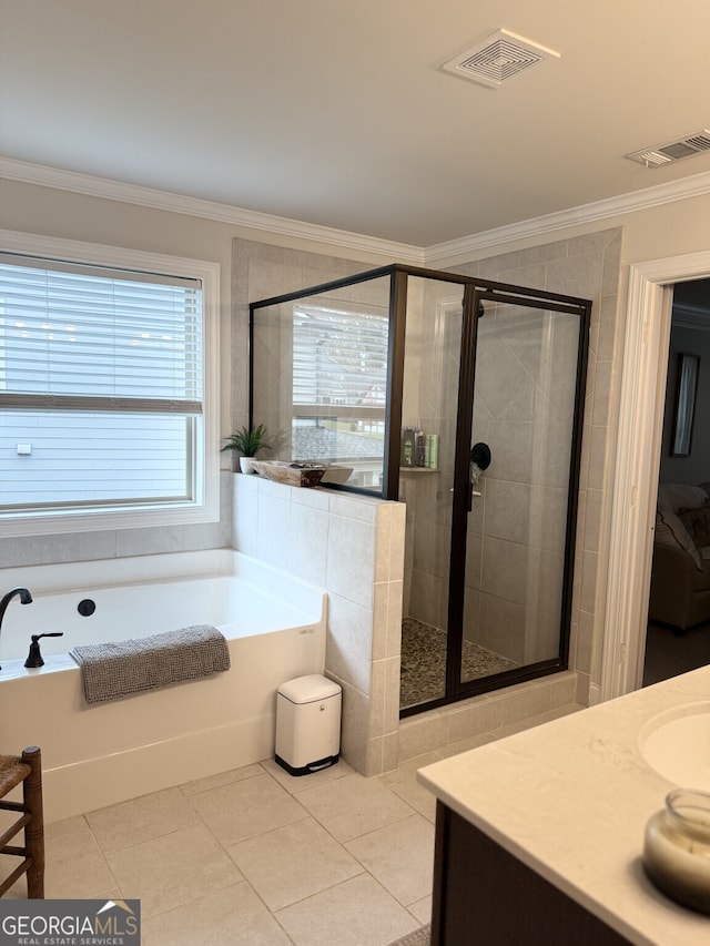 full bathroom with a shower stall, tile patterned flooring, a bath, crown molding, and vanity