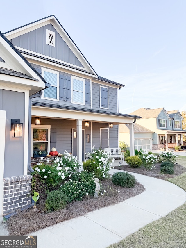 view of front of house featuring covered porch and board and batten siding