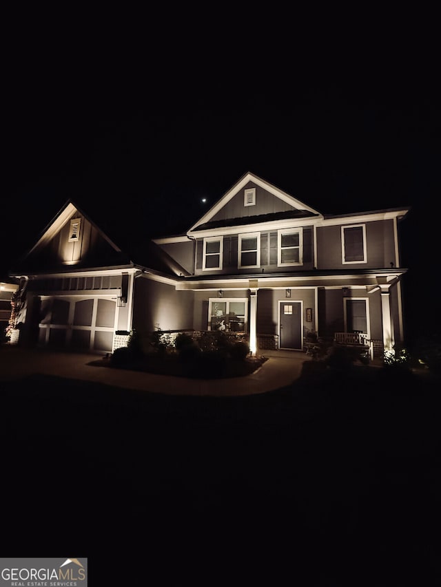 view of front of property featuring a garage and concrete driveway