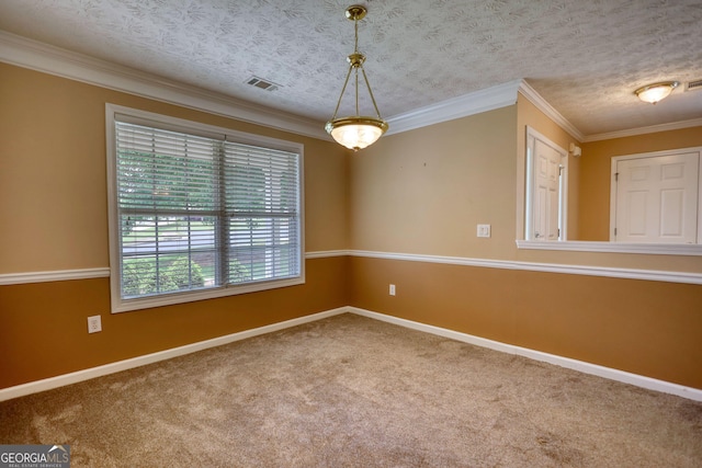 carpeted spare room with baseboards and ornamental molding