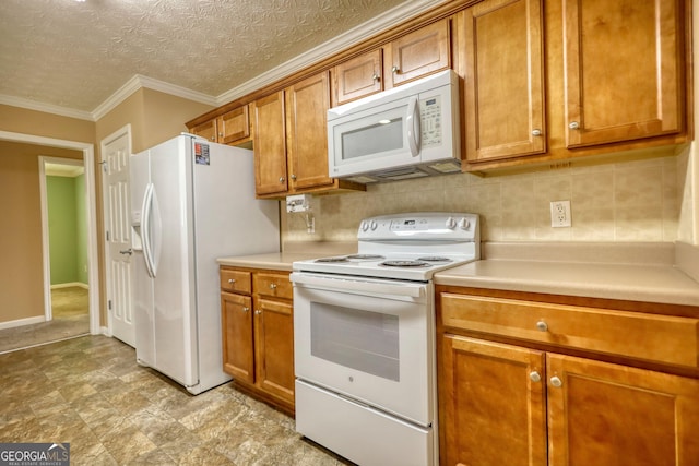 kitchen with white appliances, brown cabinets, light countertops, and ornamental molding