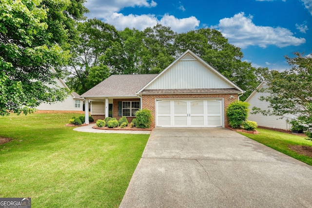 view of front of house featuring a front lawn, brick siding, driveway, an attached garage, and board and batten siding